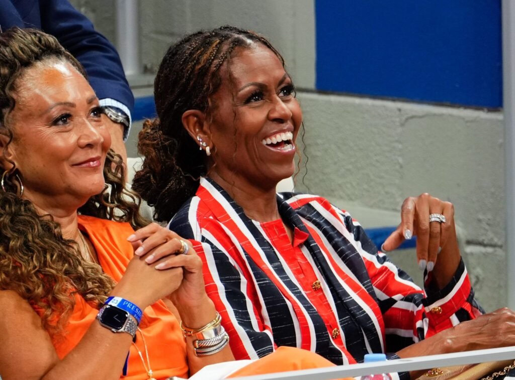 Michelle Obama turns heads at US Open with diamond-covered ears and a ring seen “from miles away”